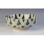 A Japanese porcelain green ground and foliate decorated bowl, 20th century, four character mark to