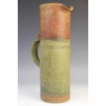 A Robin Welch (British, 1936-2019) cylindrical stoneware ewer, applied loop handle with