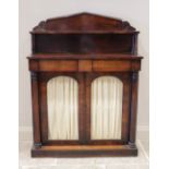 A William IV rosewood chiffonier, the architectural pediment with a single shelf raised upon ring