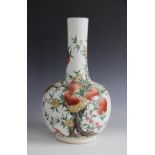 A Chinese porcelain bottle vase, 20th century, of typical form, externally decorated with peaches