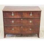 An early 19th century mahogany chest of drawers, the rectangular moulded top over two short and