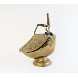 A 19th century Adam style helmet shaped coal purdonium and shovel, of classical form with hinged