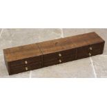 An early 20th century oak desk top chest, the central hinged compartment with faux drawer