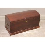 A 19th Century mahogany domed trunk, applied with brass side swing handles, opening to a removable