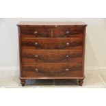 A Victorian mahogany chest of drawers, the rectangular top with rounded front corners, above an