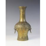 A Chinese bronze baluster vase, early 20th century, in the archaic manner with two reticulated