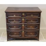 An early 18th century oak chest of drawers, the three plank moulded top above an arrangement of