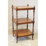 A Victorian mahogany etagere/what-not, the conical shaped finials upon ring turned baluster shaped