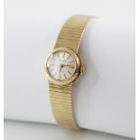 A lady's vintage Majex 9ct gold 21 jewels incabloc wristwatch, round cream dial with gold toned
