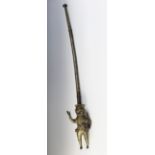 A large West African Benin Nigeria brass pipe terminating with a colonial soldier figure, 81cm long