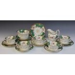 A Coalport green batwing part tea service, early 20th century, comprising: five teacups (one at