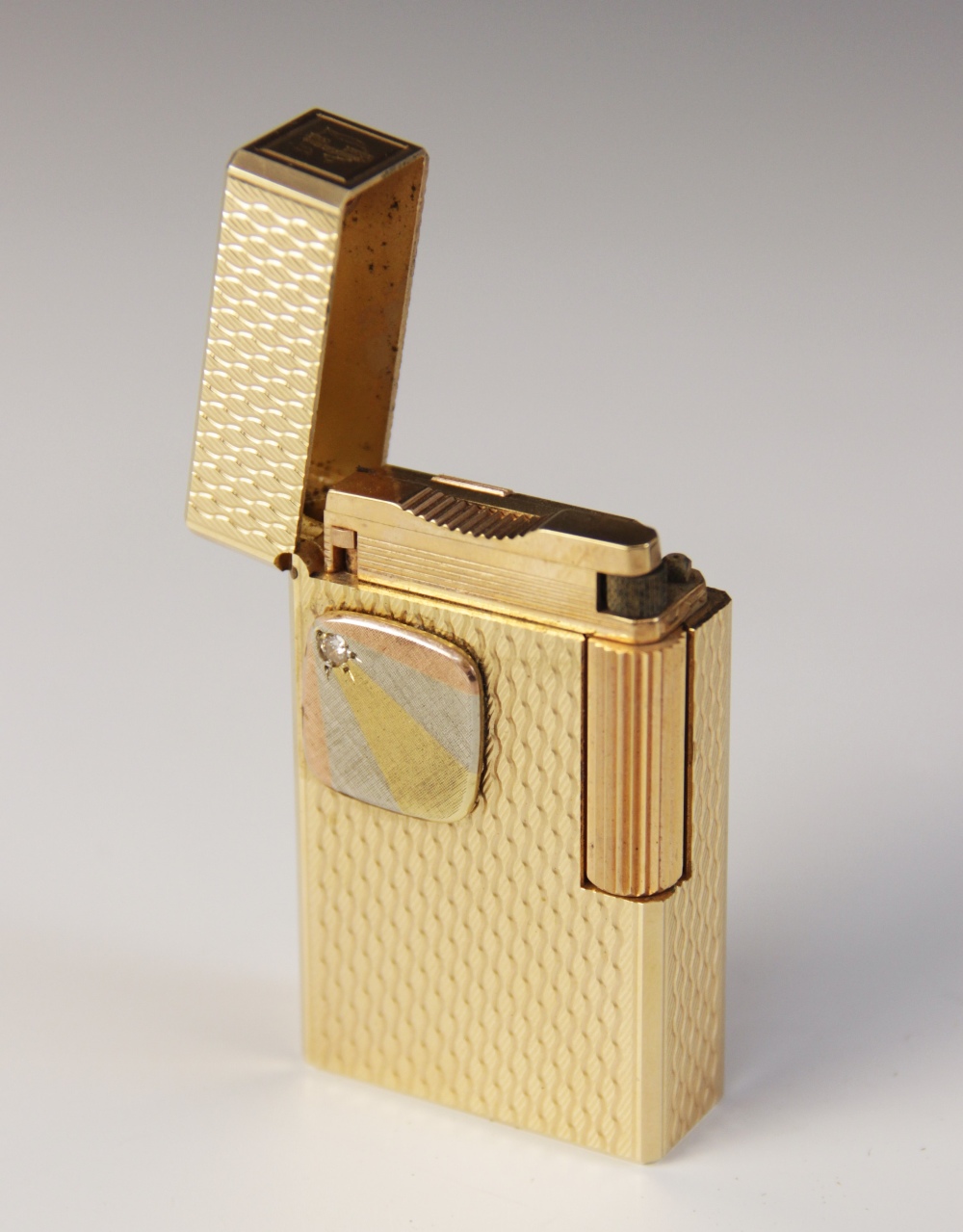 A Dupont diamond set gold plated lighter, of rectangular form with engine turned decoration, applied - Image 4 of 5