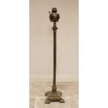 An early 20th century brass Corinthian column telescopic standard lamp, with a brass lamp