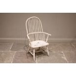 A 19th century painted white ash and elm Windsor chair, the comb spindle back above a solid seat