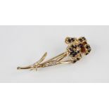 A sapphire and diamond 14ct gold floral brooch, designed as an iris, the petals set with round mixed