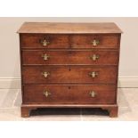 A George III oak chest of drawers, the rectangular moulded top above two short and three long