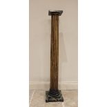 A late 19th/early 20th century faux marble pedestal stand, the simulated marble top upon a painted