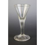 A conical wine or cordial glass, the stem with full length tear drop extending into the bowl,