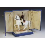 A Vienna porcelain figure of a rider on horseback, depicting a rider from the Spanish Riding School,