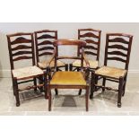 A matched set of four ash ladder back chairs, early 19th century, each with an envelope rush seat on