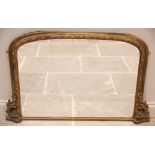 A 19th century giltwood and gesso over mantel mirror, the frame with alternating almond shaped and