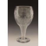 A large etched glass Moet et Chandon presentation goblet, with vine leaf decoration, raised on a