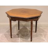 An early 20th century octagonal mahogany bridge table, by Trollope and Colls, London, with a