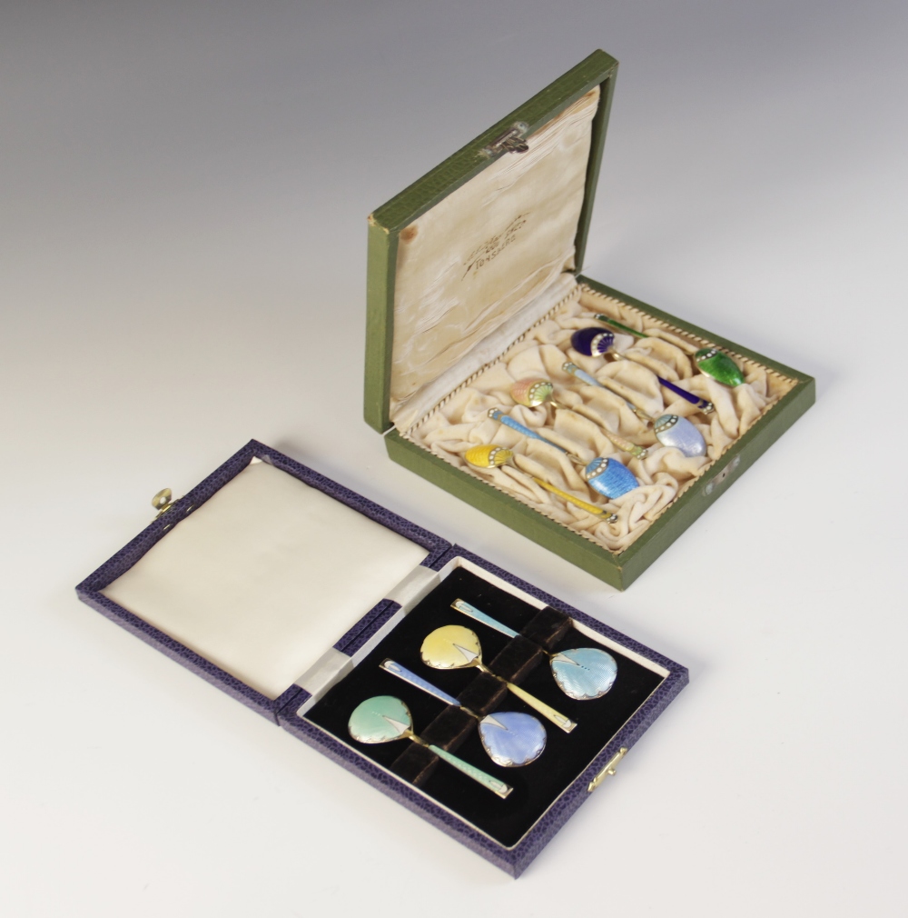 A cased set of six Danish enamelled silver gilt coffee spoons by Marius Hammer, each with engine