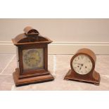 An early 20th century oak cased bracket clock, the architectural case enclosing the 15cm gilt