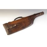 An early 20th century leg of mutton leather gun case, applied with leather strap handles and brass