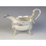 A George III silver sauce boat, marks for London 1761 (maker's marks worn), of typical form with