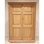 A Victorian and later pine freestanding corner cupboard of large proportions, with internal