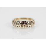 A diamond set 14ct gold ring, comprising fifty graduated round brilliant cut diamonds, all rubover