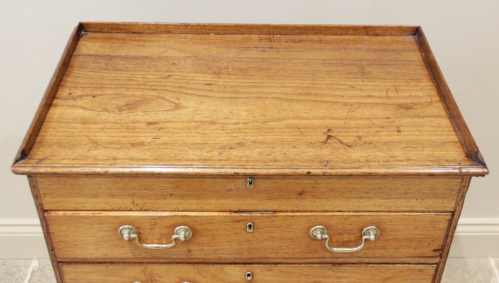 A late 19th century two section teak campaign chest, the hinged top with a three quarter gallery - Image 2 of 4