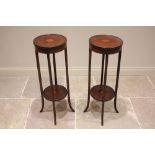 A pair of Edwardian mahogany and cross banded jardinière stands, each centred with an inlaid