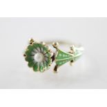 A 9ct gold enamel and pearl set dress ring, the central daisy shaped head set with a cultured