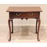 A George II mahogany side table, the rectangular moulded top with indented front corners, above a