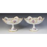 A pair of Meissen pedestal compotes, late 19th century, each finely decorated in polychrome