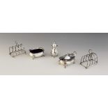 A pair of Edwardian novelty silver four-division toast racks by Hukin & Heath, Birmingham 1906, each