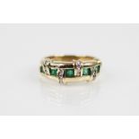 An emerald and diamond set 14ct gold ring, the woven design ring comprising brilliant cut diamond