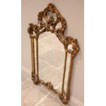 A Louis XVI style gilt composite wall mirror, late 20th century, the rococo style frame with a 'C'