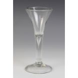 A trumpet wine or cordial glass, the bowl on tear drop stem terminating in conical folded foot,