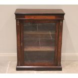 A Victorian rosewood pier cabinet, the rectangular moulded top above an inlaid frieze and a single