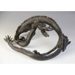 A Japanese bronze model of a dragon, 20th century, modelled as a three-clawed fierce scaly dragon,