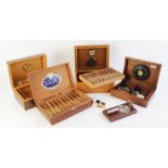 A collection of smoking ephemera to include, three cigar humidors, one mounted with a silver plaque,
