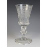 A clear glass engraved German presentation goblet, 19th century, the bowl finely engraved with an