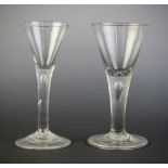 Two conical wine or cordial glasses, one on double tear drop stem, the other on single tear drop