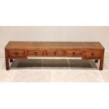 A Chinese elm Kang table, the rectangular cleated top above an arrangement of five frieze drawers,