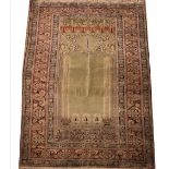A fine knotted Ottoman empire Turkish prayer rug, woven with kurk wool/silk and decorated with a