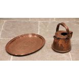 An Arts and Crafts style oval copper tray in the manner of Keswick School of Industrial Arts,